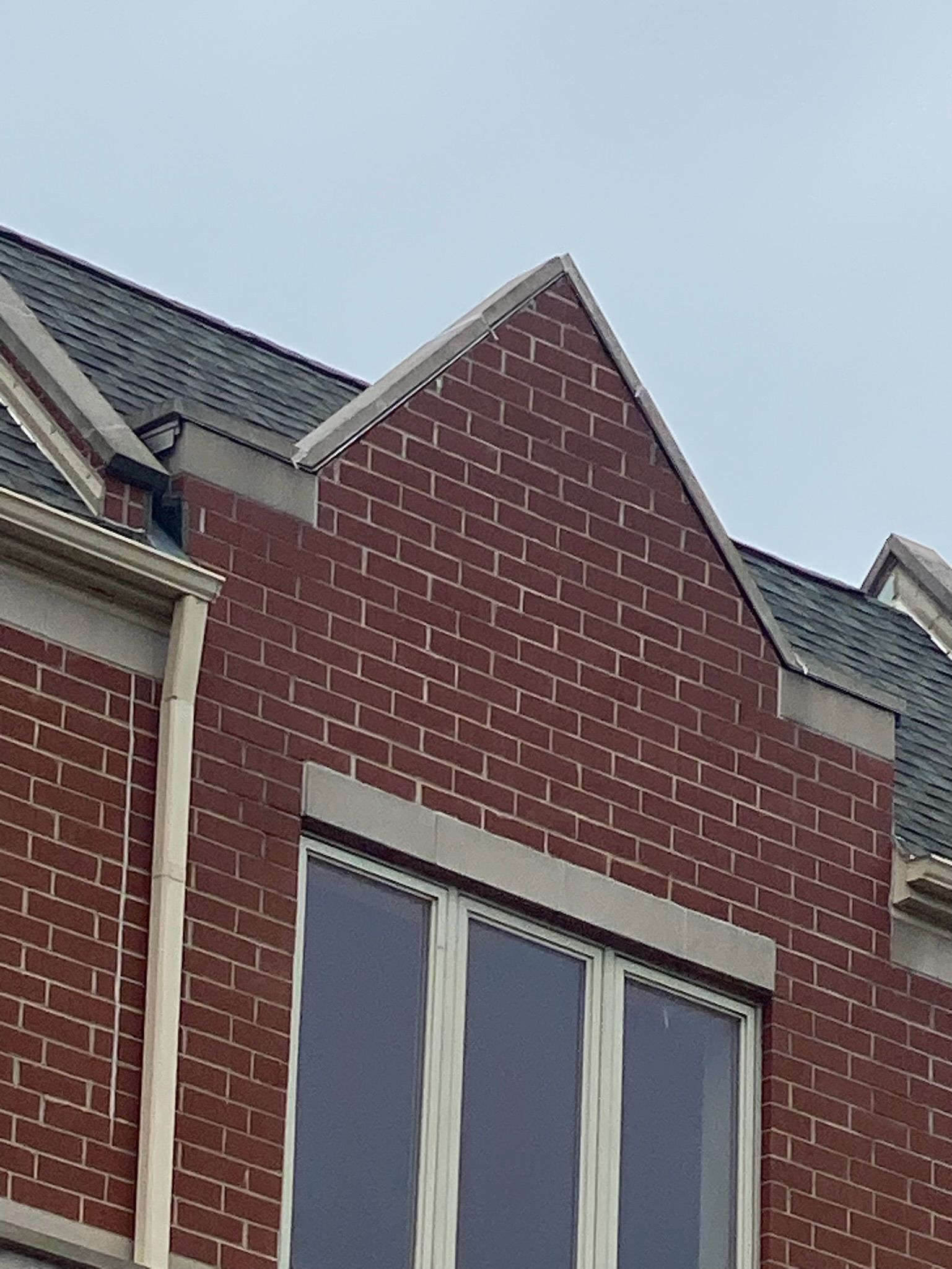 Close-up of apartment building facade front peak point