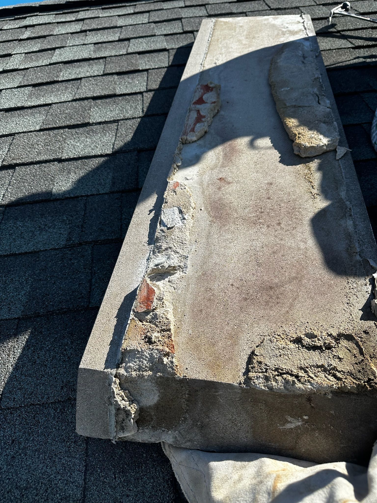 Close-up of bottom of damaged rooftop capstone