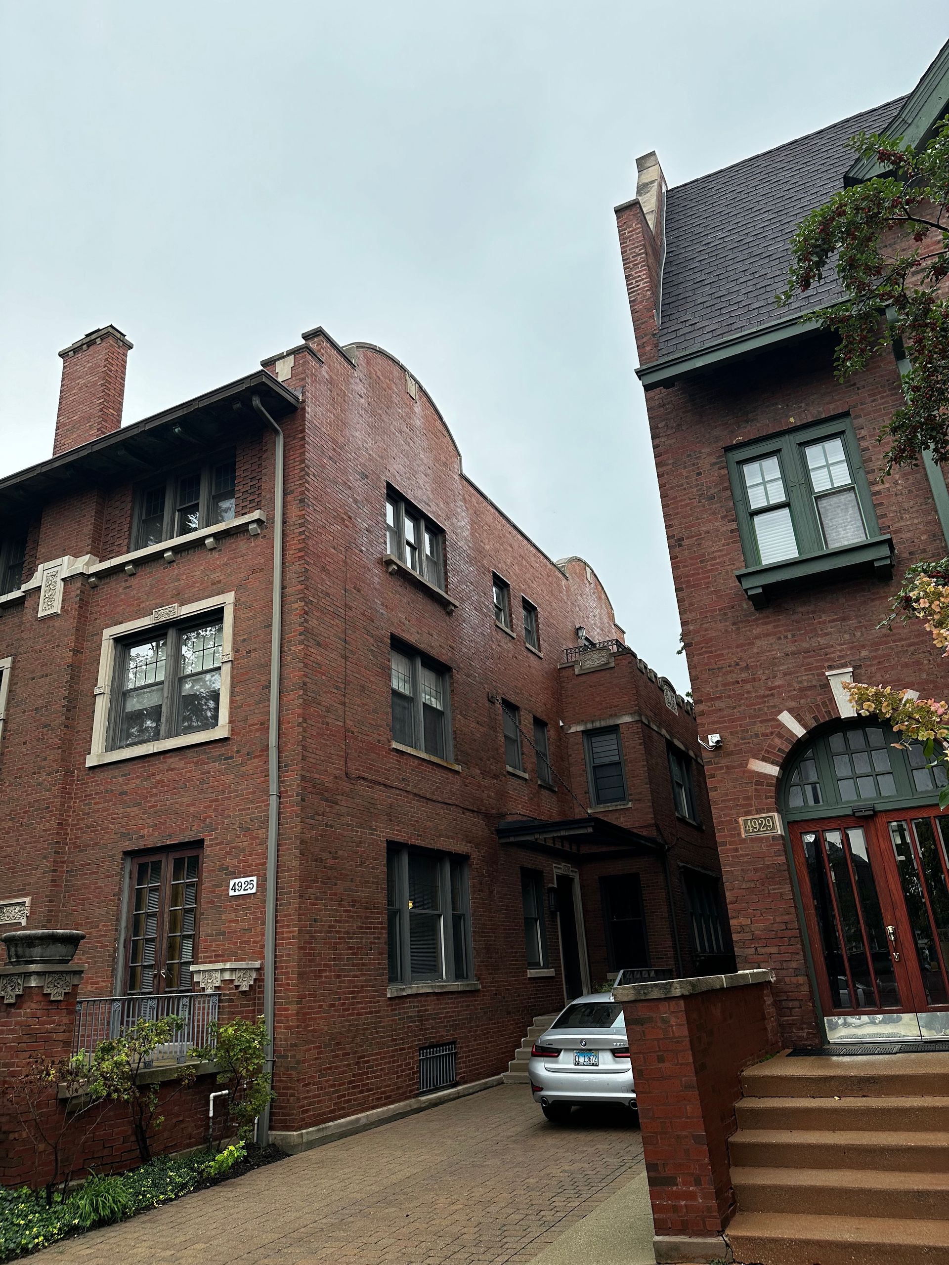 Historic red brick building with water damage