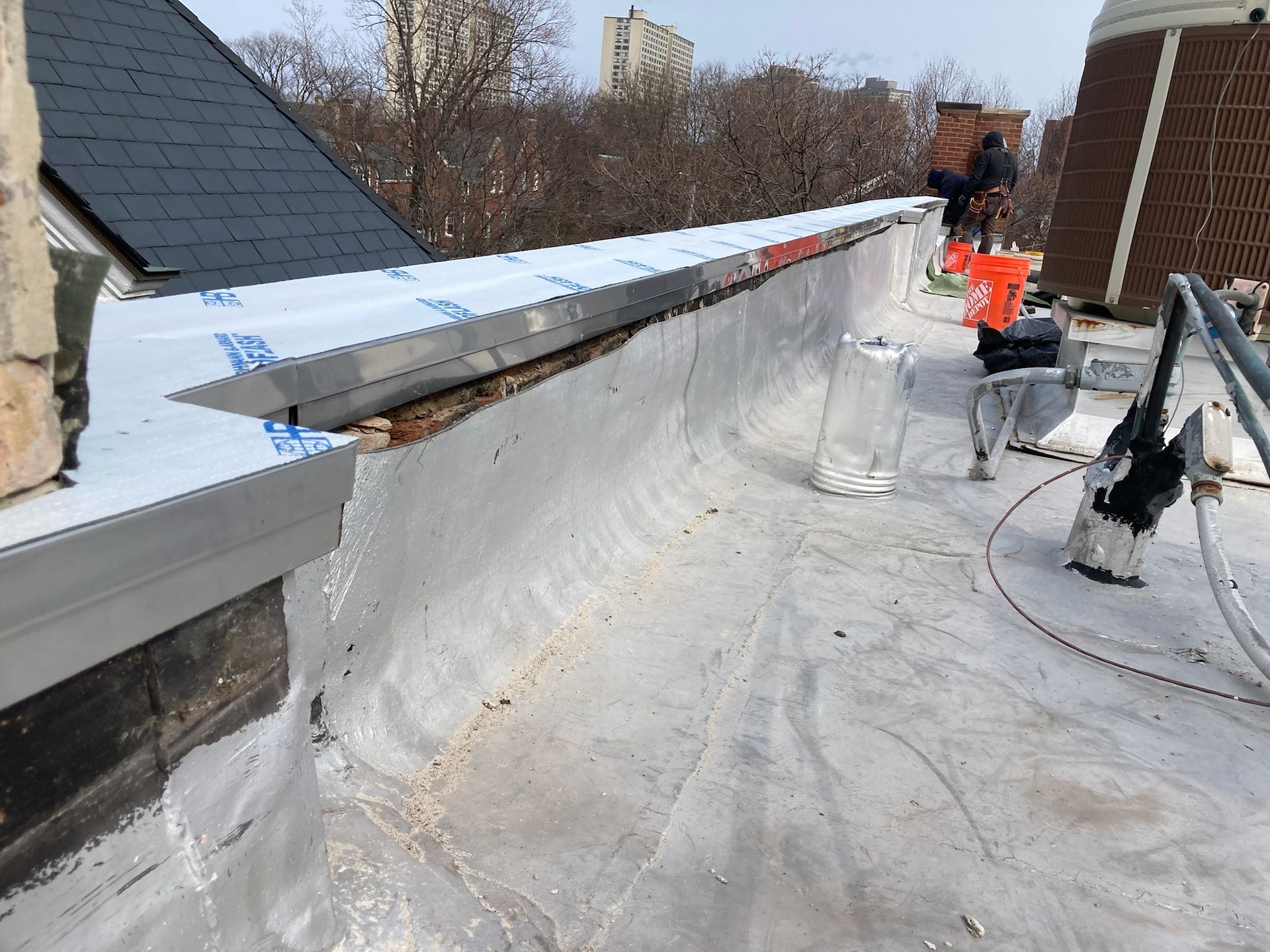 Installed flashing on top of parapet wall