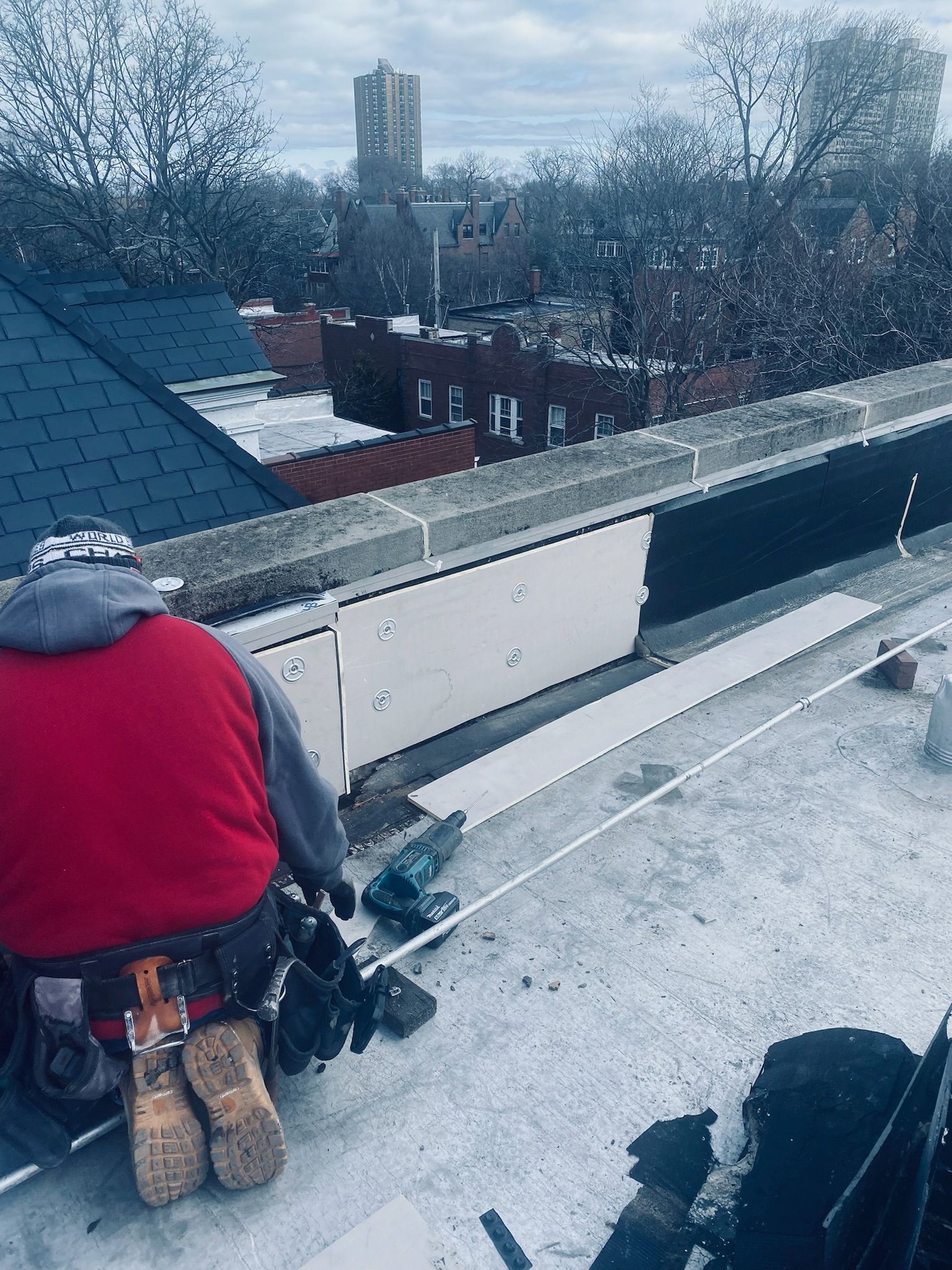 Worker installing venting system