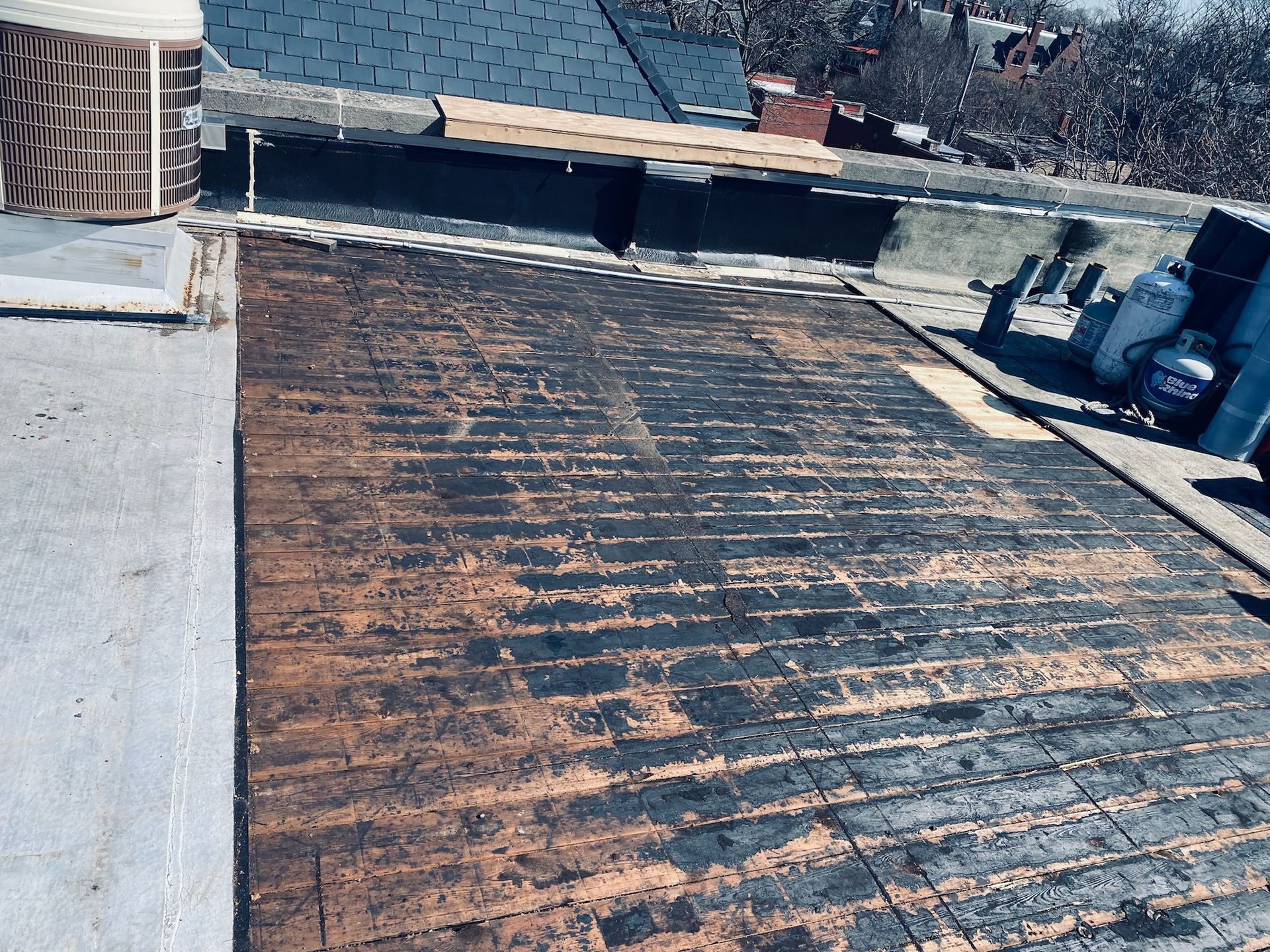 Flat rooftop with damaged wooden floor