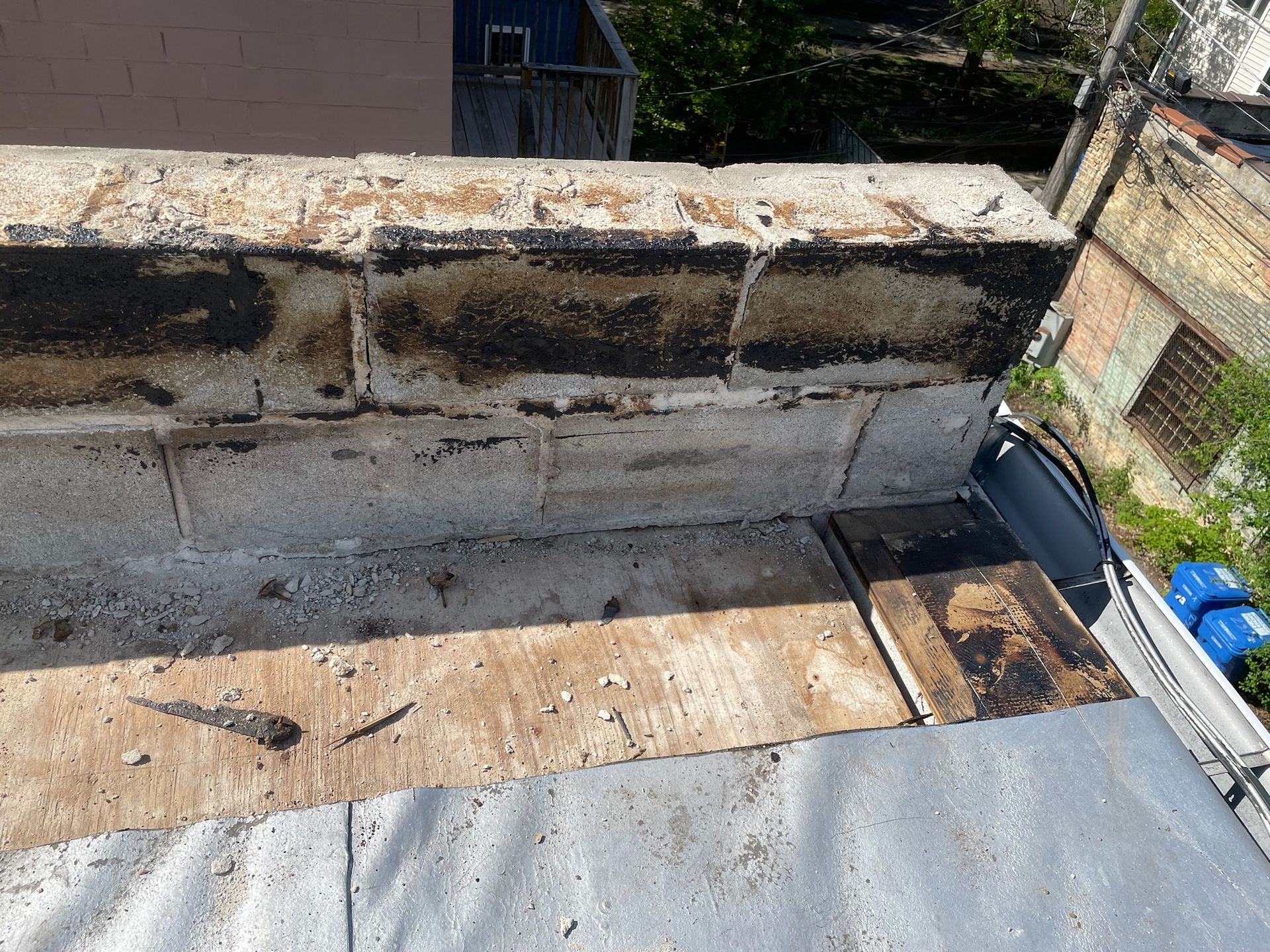 Removed roof membrane from rooftop parapet wall
