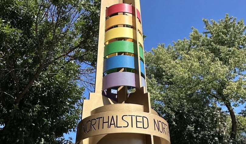 Rainbow-colored tower sculpture at Northalsted
