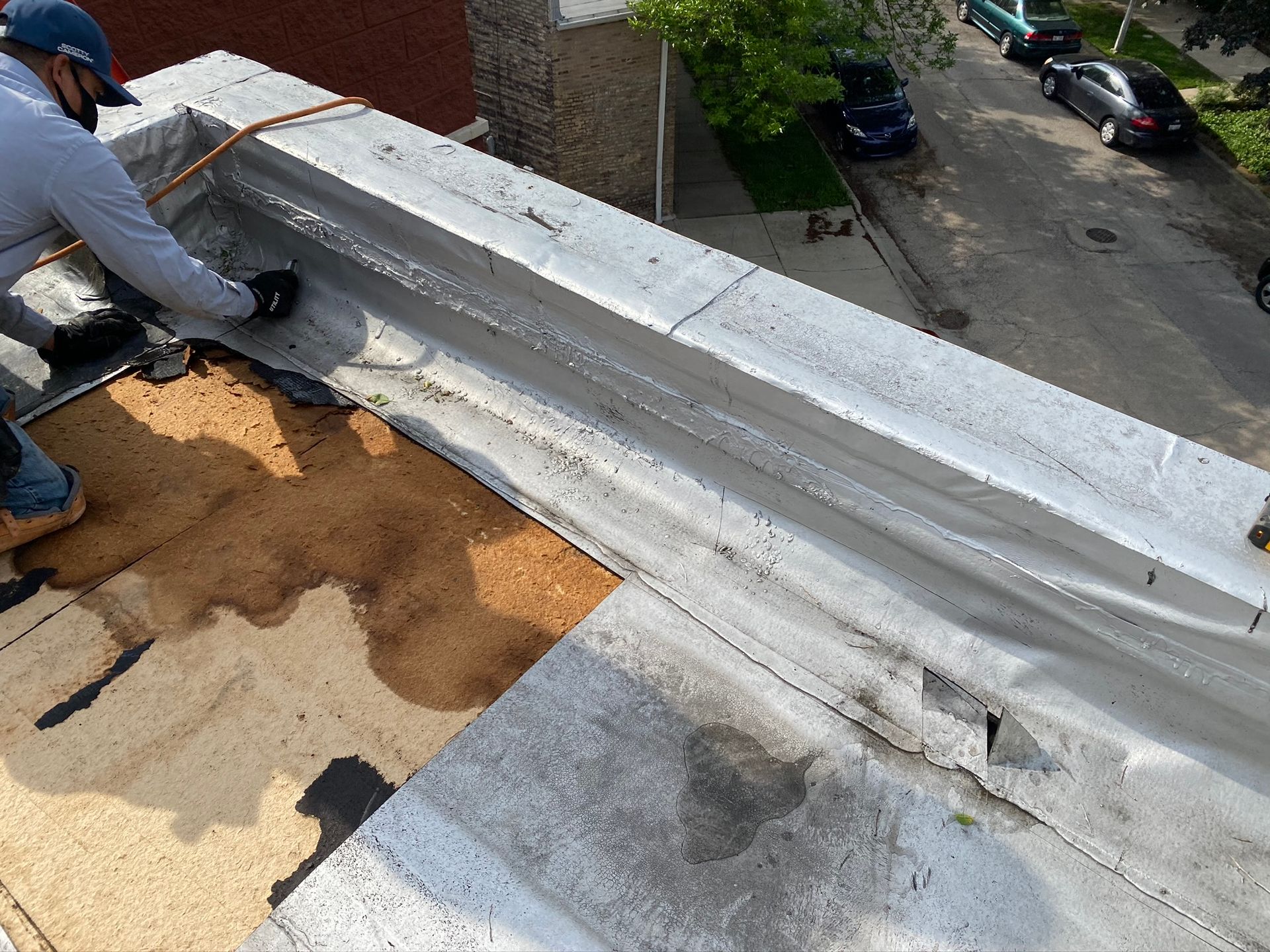 Roof repair on split face block building in Buena Park, Chicago