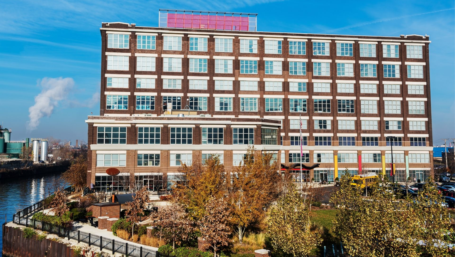 Brick office building beside a canal