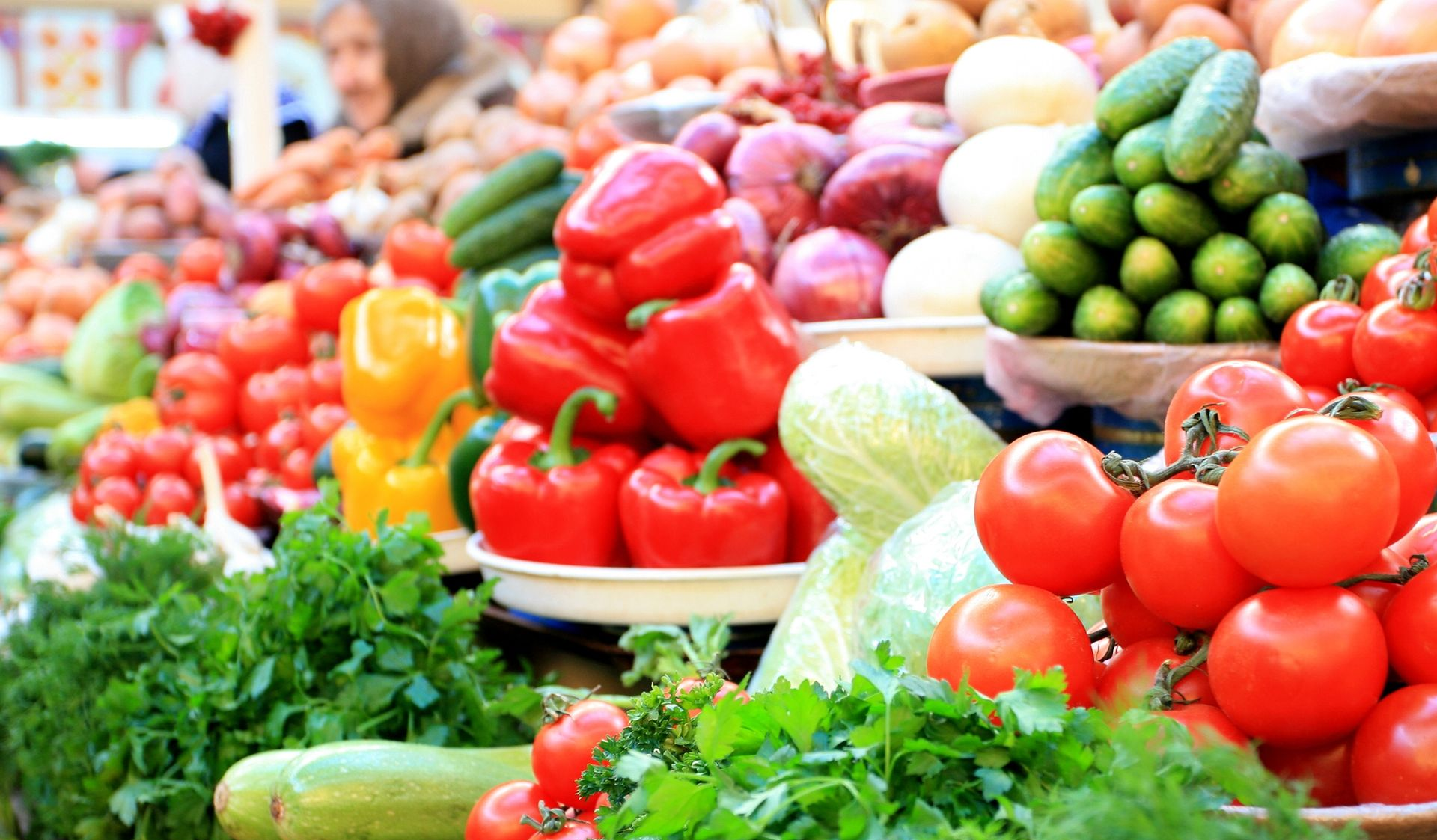 Colorful display of fresh fruits and vegetables at a market stall
