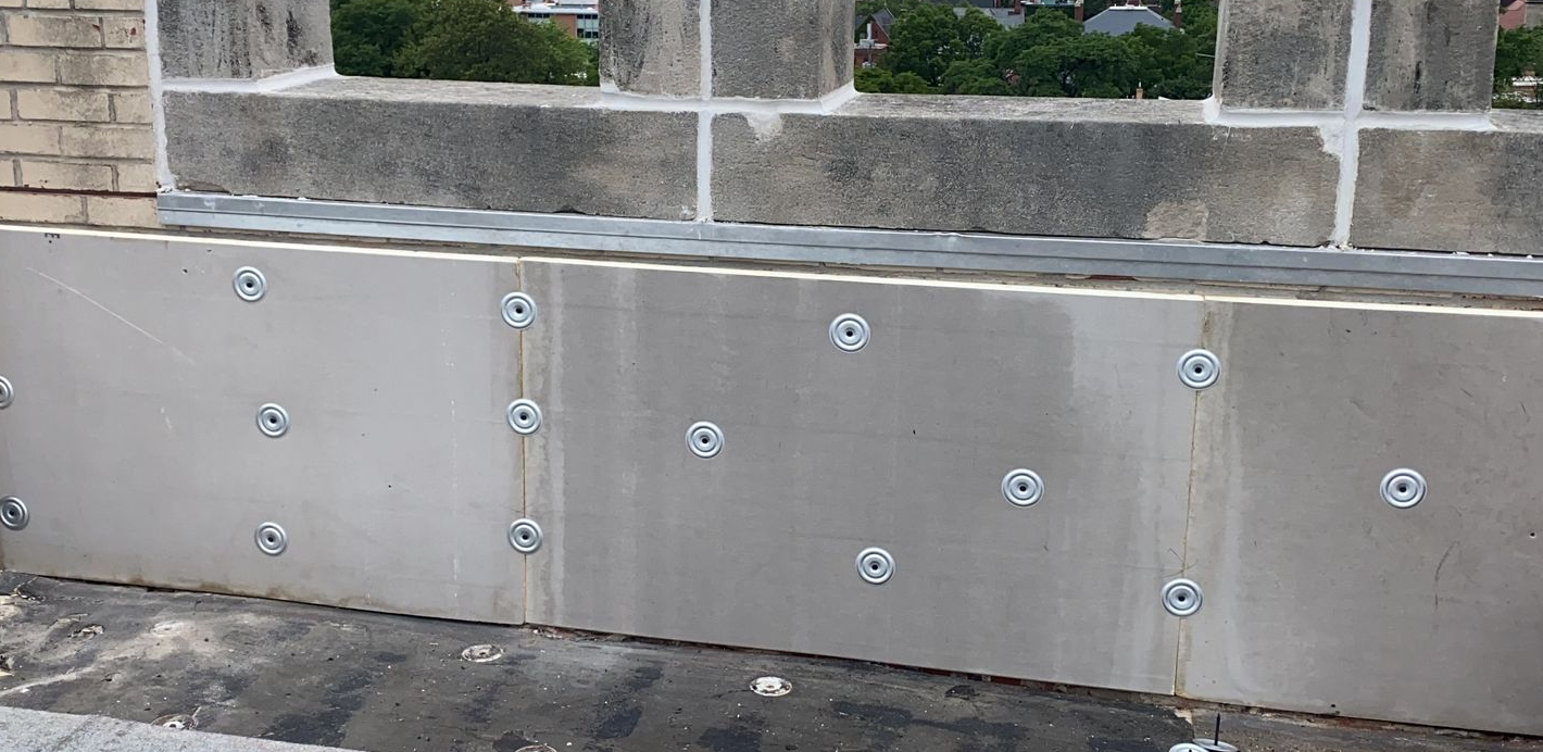 Parapet wall with roof vent installed