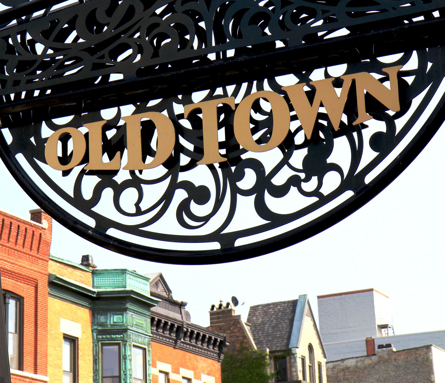 “OLD TOWN” sign on an ornate black iron arch
