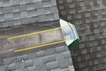 Storm Drain on gray shingle rooftop