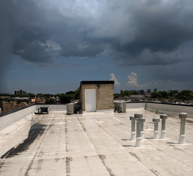 Wet parapets with metal copings with inadequate leg length take on summer storm, Chicago