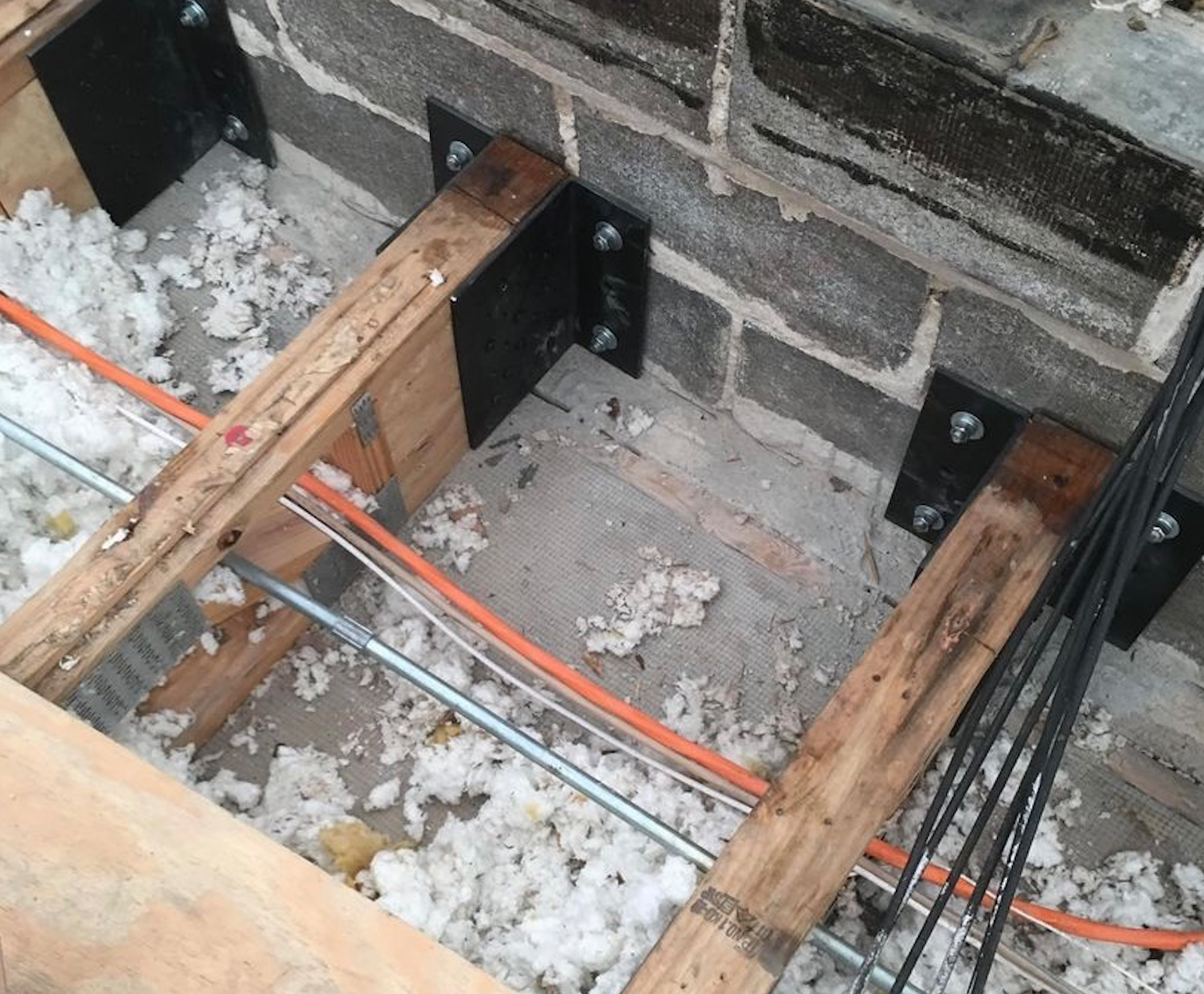 WickRight truss brackets installed on newly reinforced trusses in Lincoln Park, Chicago