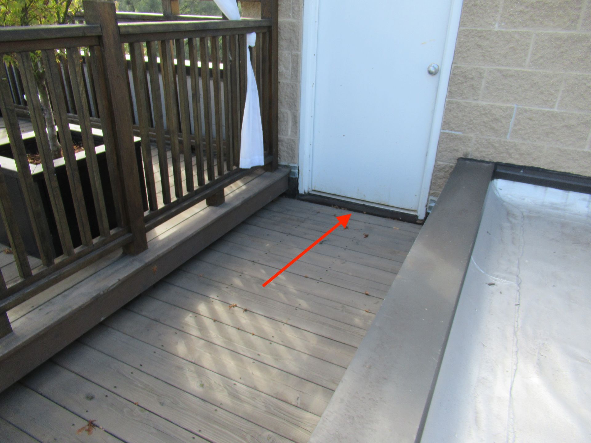 Rooftop building door with insufficient clearance above roof deck, Rogers Park, Chicago