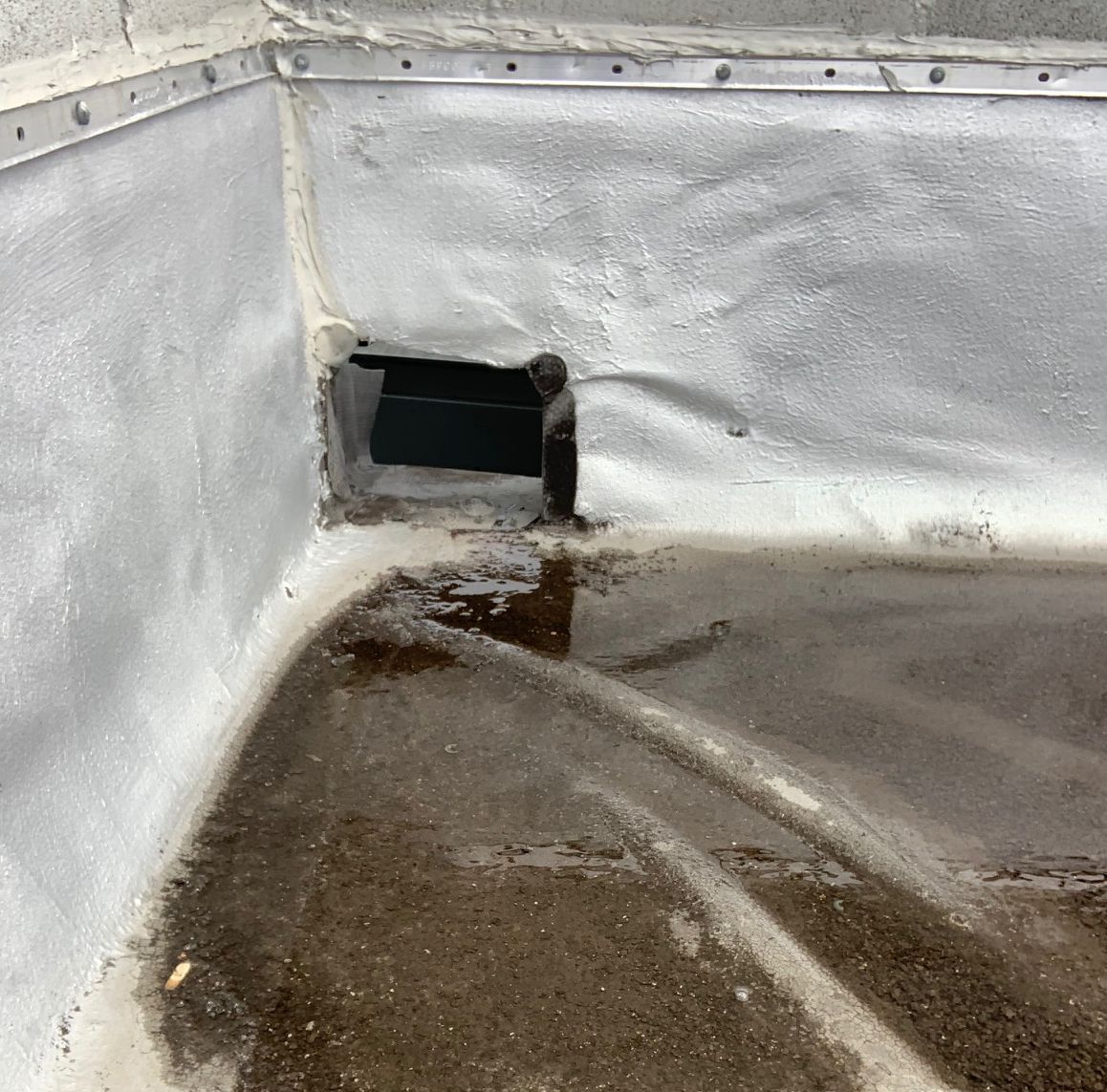 Water ponding near scupper in Uptown, Chicago