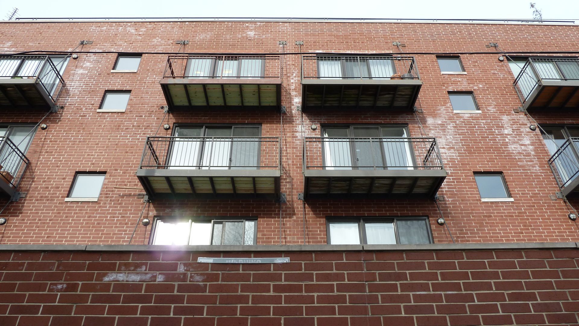 Wet brick building with brick spalling Lincoln Park, Chicago