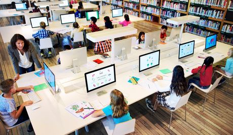 Students in technology-equipped classroom
