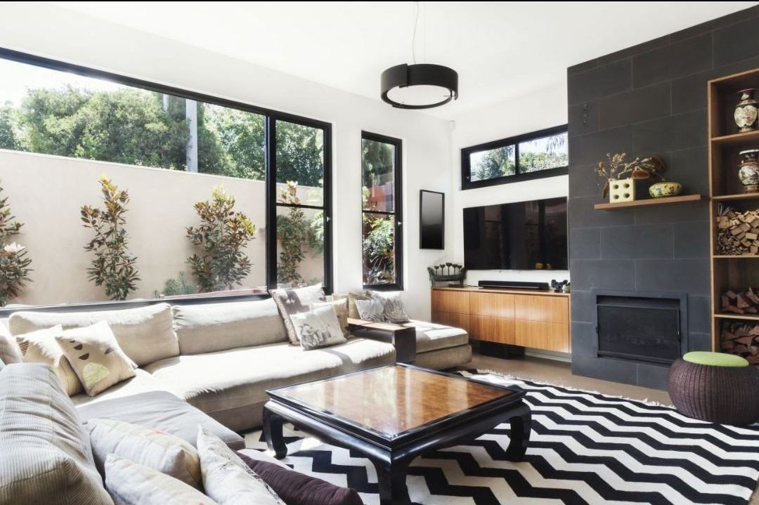 A living room with a couch and a coffee table