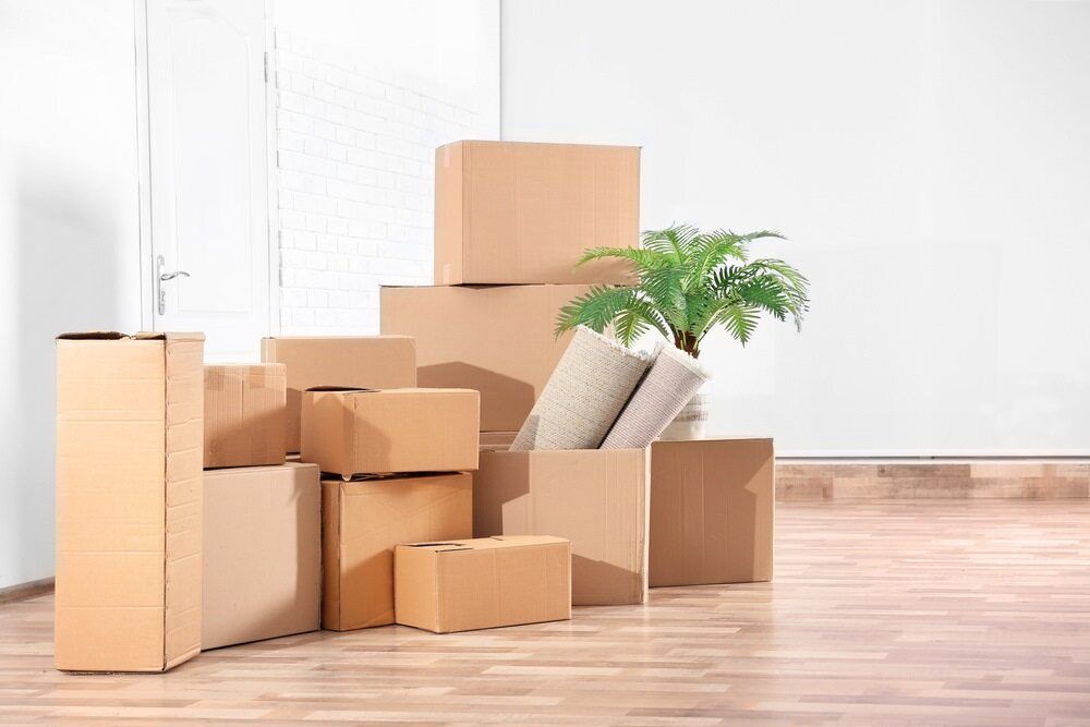 A Bunch Of Cardboard Boxes Are Stacked — Newcastle Moving & Storage in Gosford, NSW