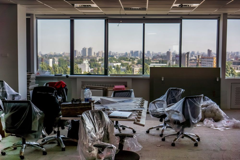 An Empty Office With A Lot Of Chairs And Tables — Newcastle Moving & Storage in Wyong, NSW