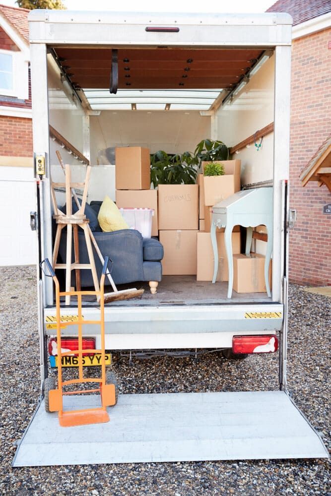 A Moving Truck Is Filled With Boxes And Furniture — Newcastle Moving & Storage in Swansea, NSW