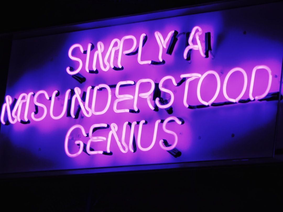 Purple neon sign, text reads: 
