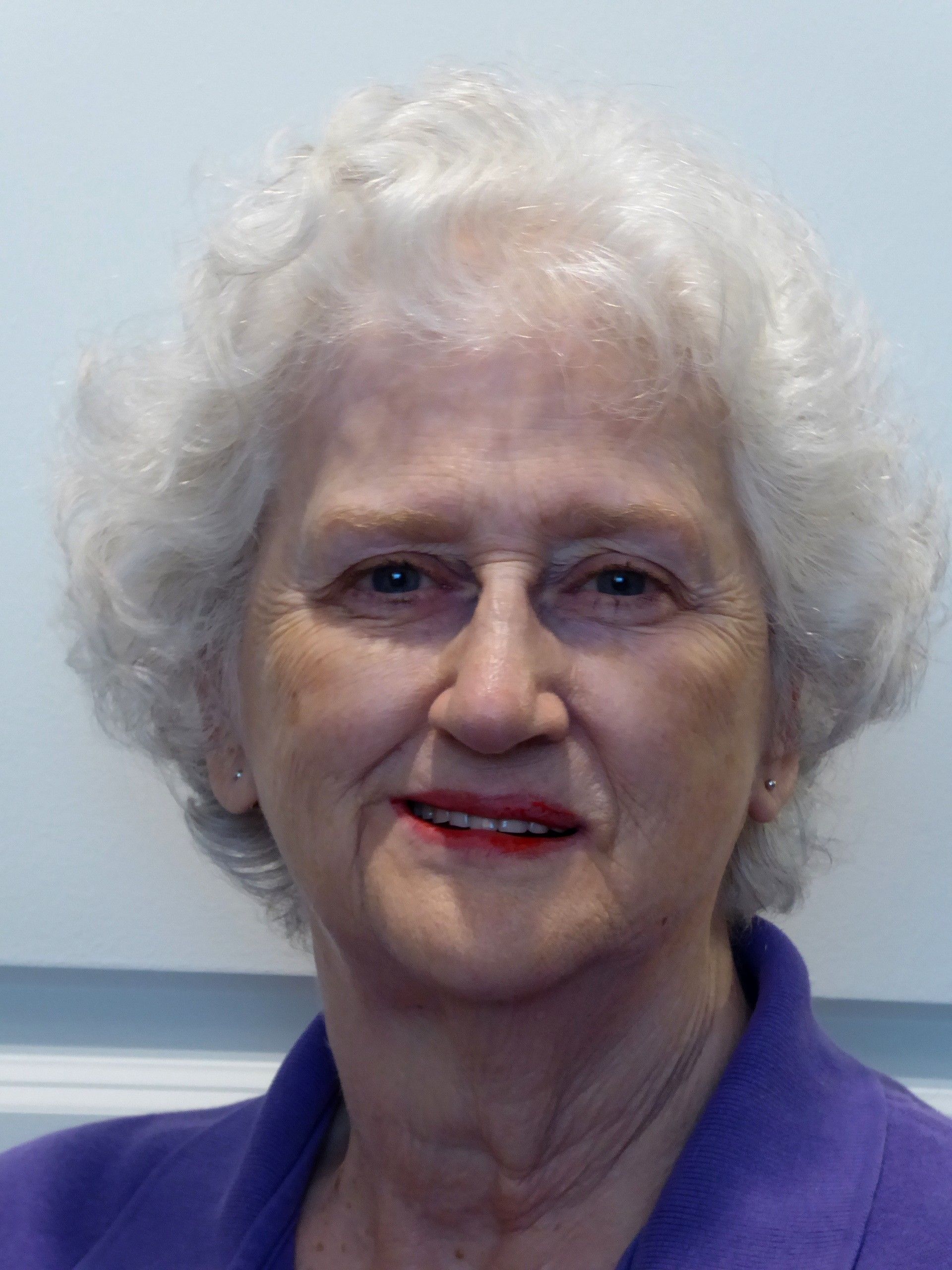 A woman is smiling for camera