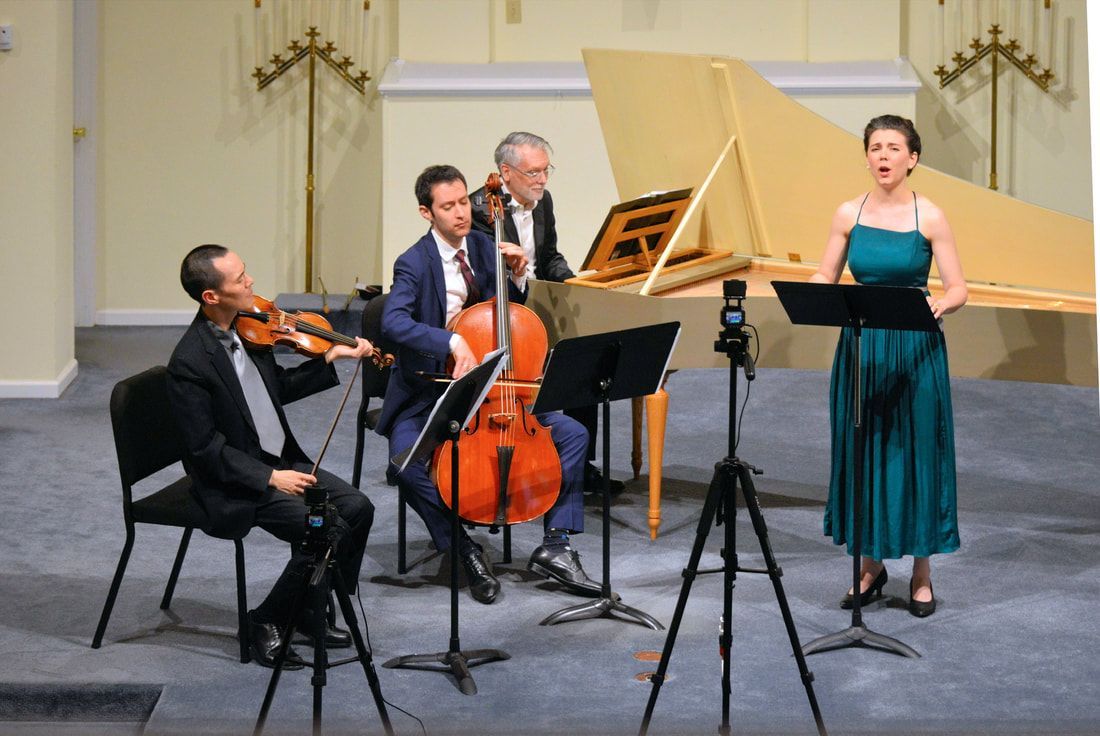A group of people are playing instruments on a stage.