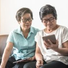women looking at a tablet