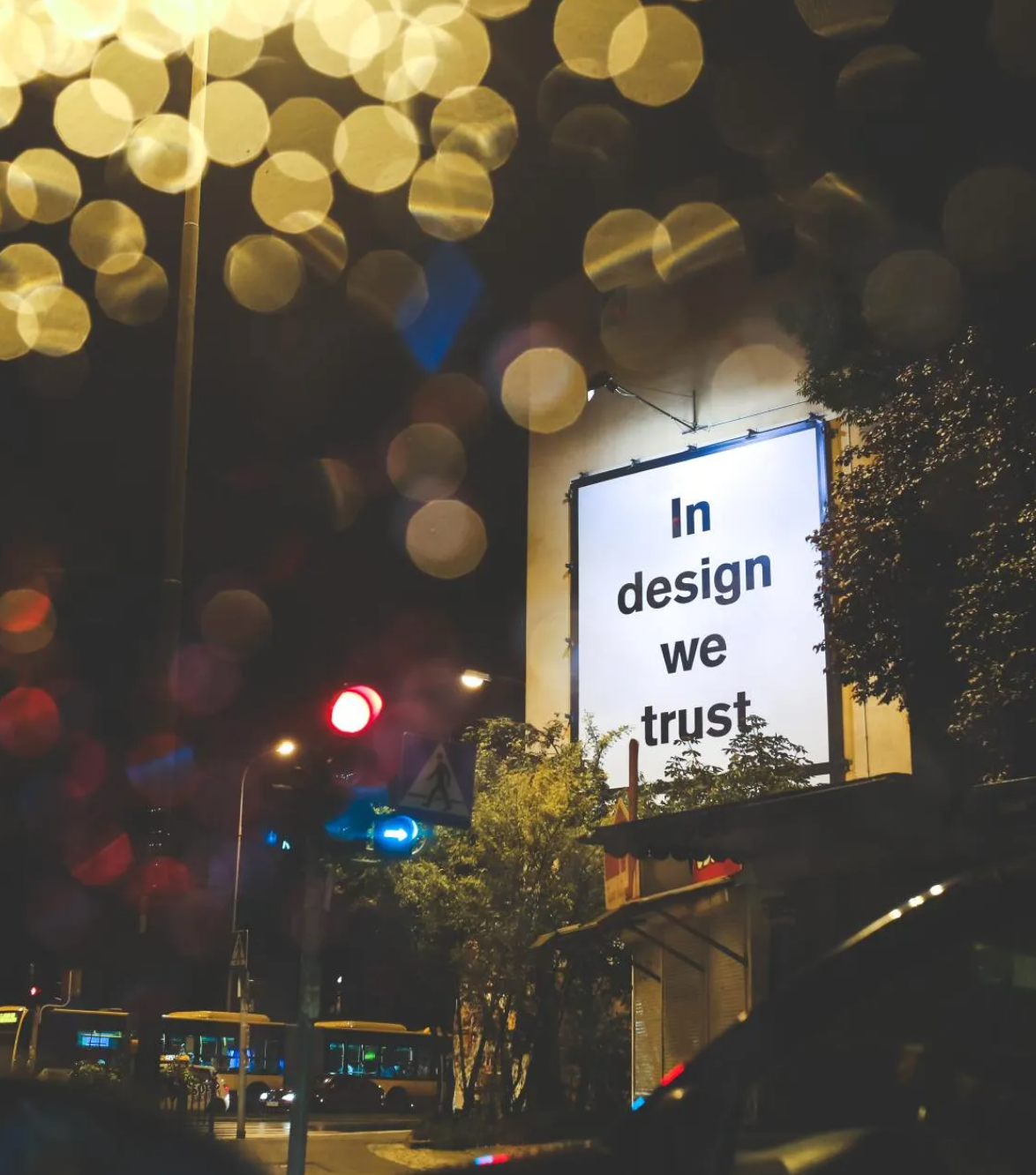 A sign on a building that says in design we trust
