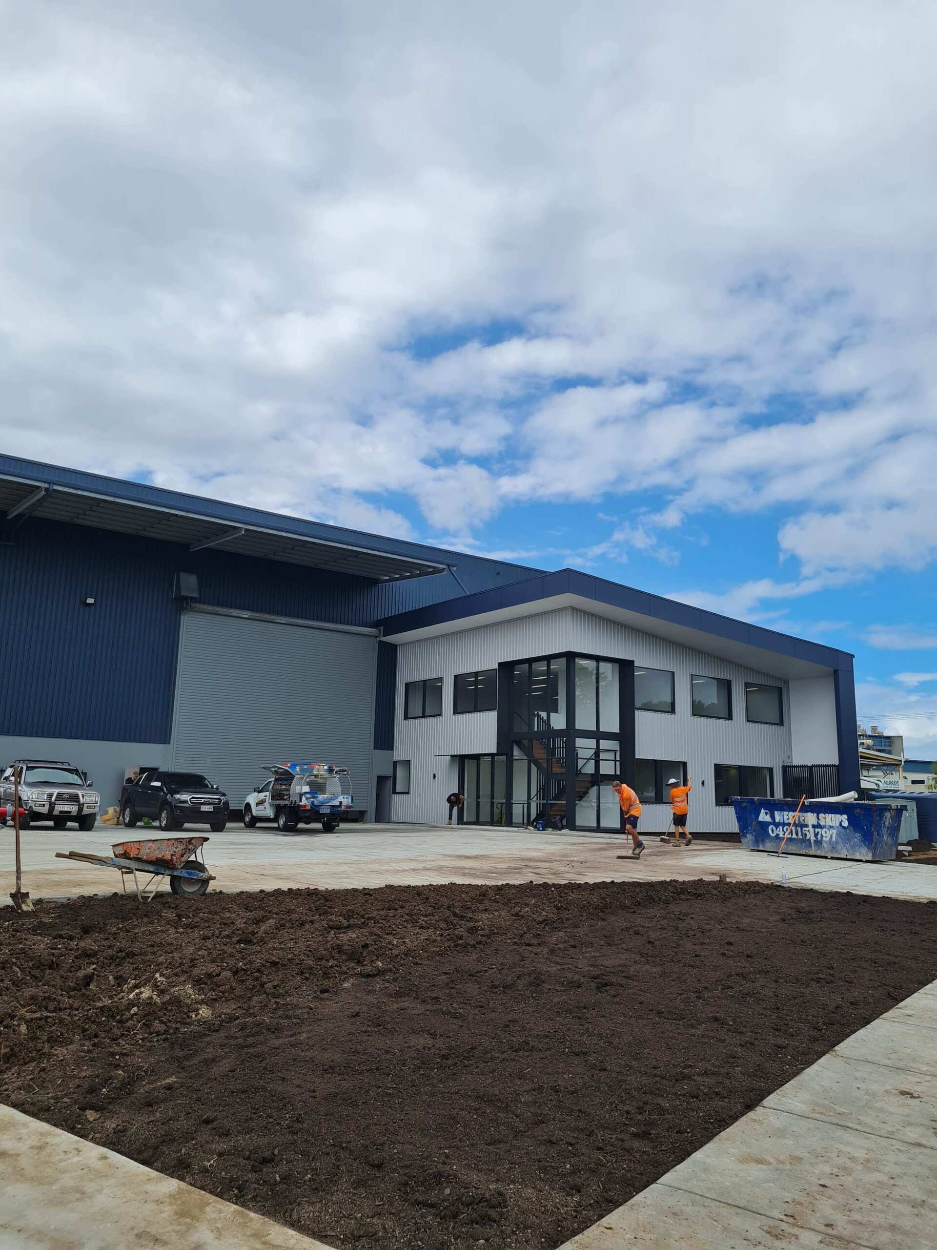 A large building with a lot of windows is being built.