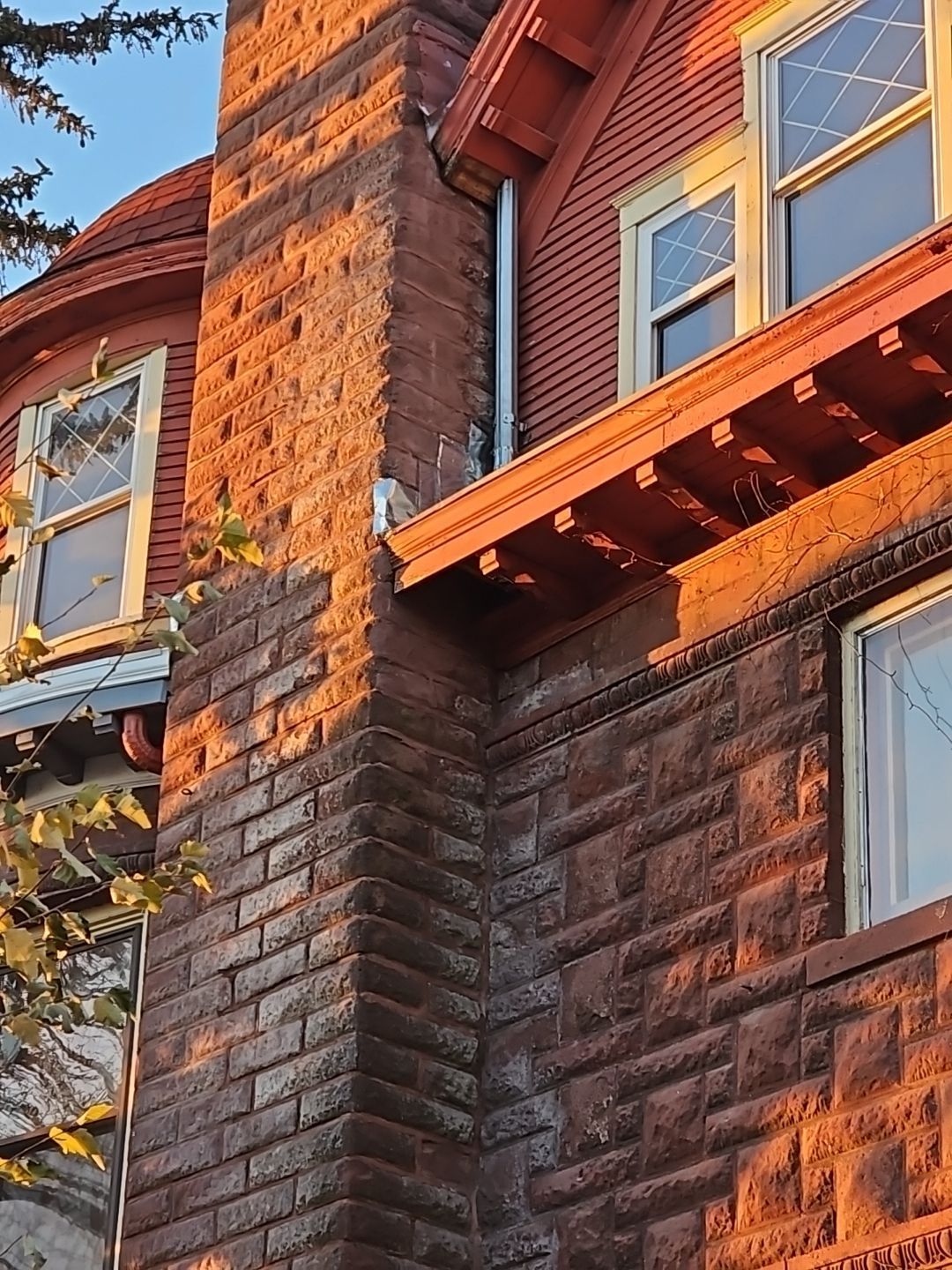 a brick building with a chimney on the side of it