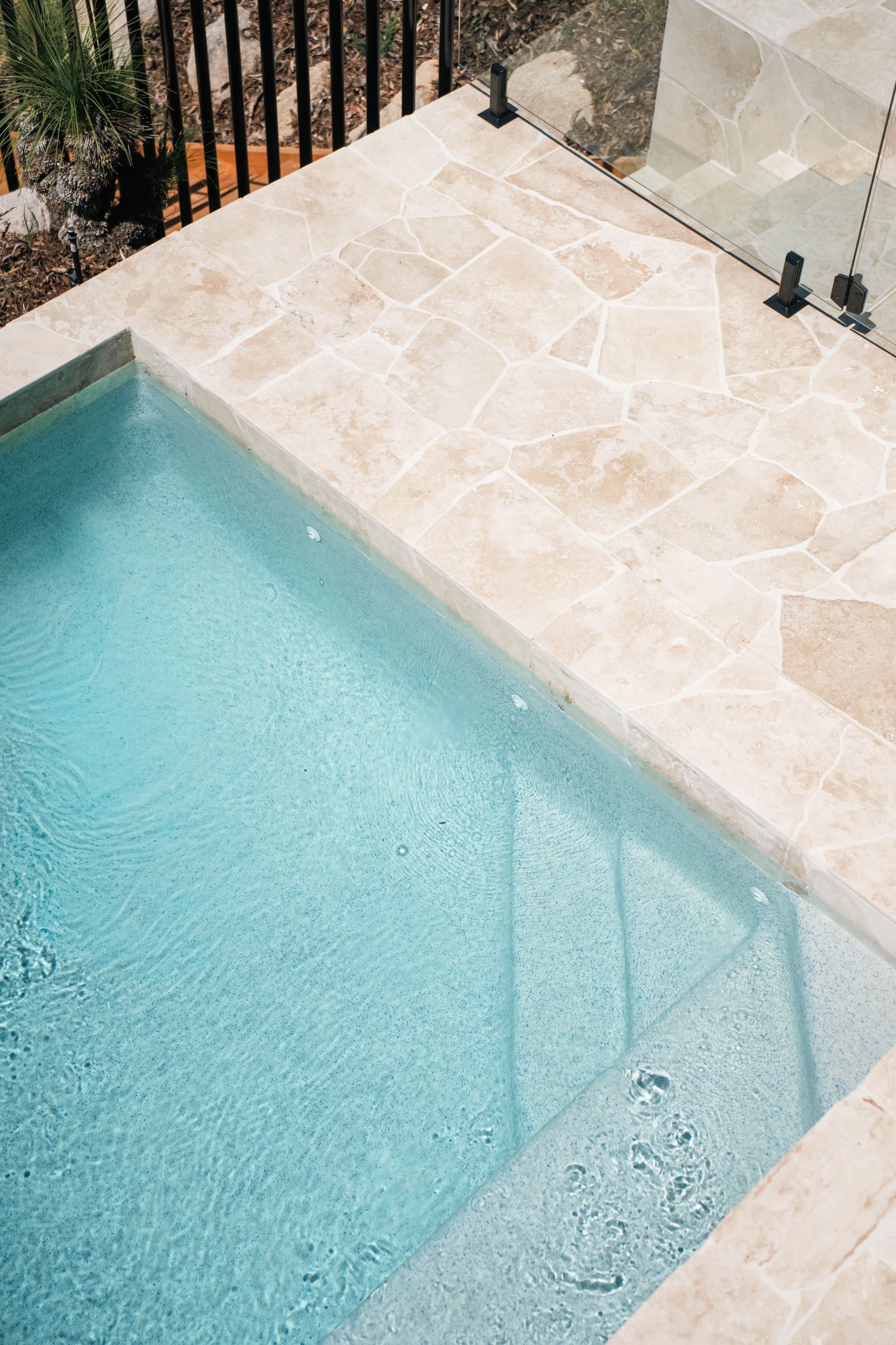 Swimming Pool With Light-colored Tiles — Concrete Pool Projects in Gladstone Central, QLD