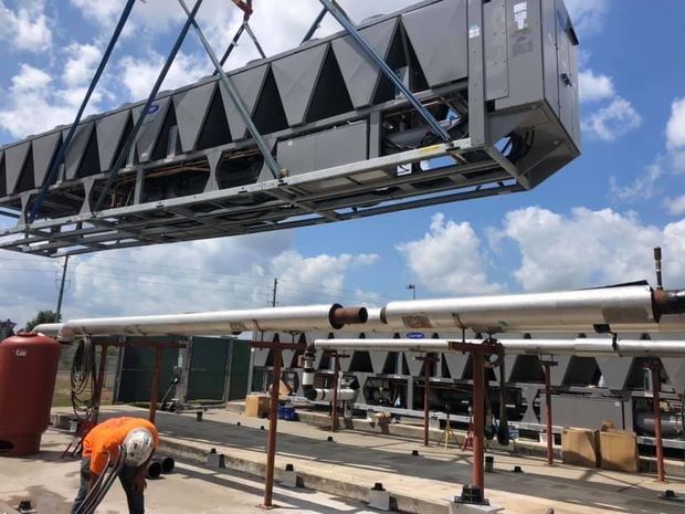Technician Installing Air Conditioner — Winter Haven, FL — Gibson Air Conditioning Technician Installing Air Conditioner — Winter Haven, FL — Gibson Air Conditioning