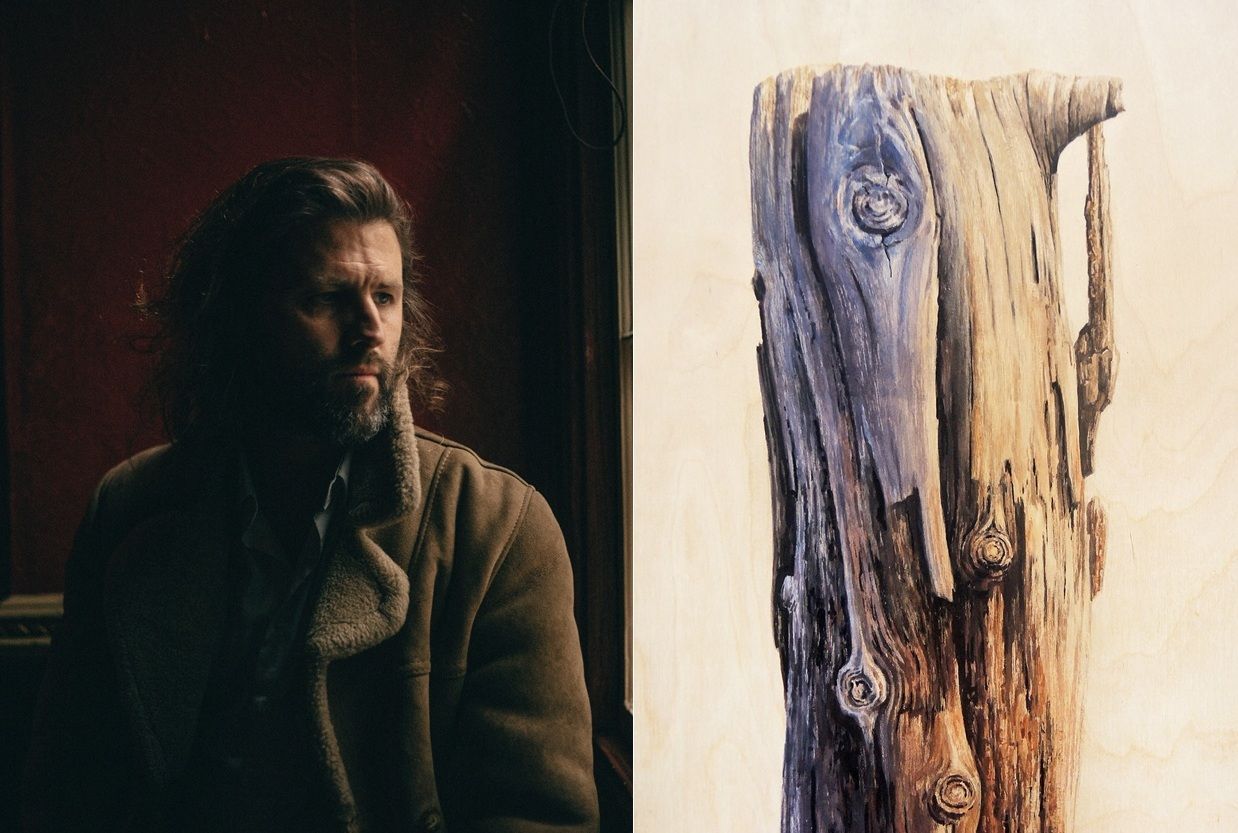 Photo of Pearse McGloughlin with Eoin Mac Lochlainn's painting An ghaoth aniar / This too will pass VI, watercolour on birch panel