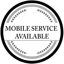 Black-and-white circular sign reading “MOBILE SERVICE AVAILABLE” with decorative laurel border