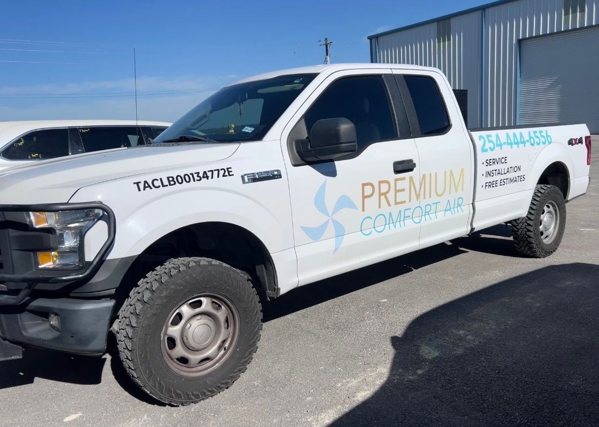 A white truck with the word premium on the side