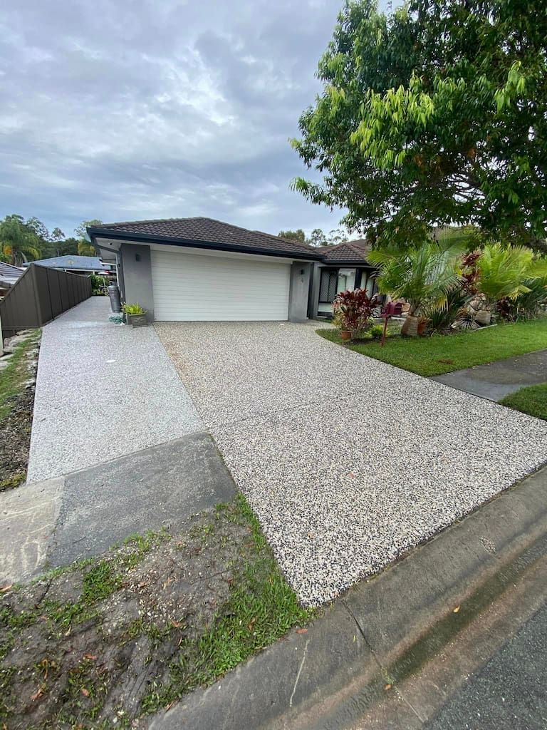 A pressure cleaned driveway leading up to a gold coast house
