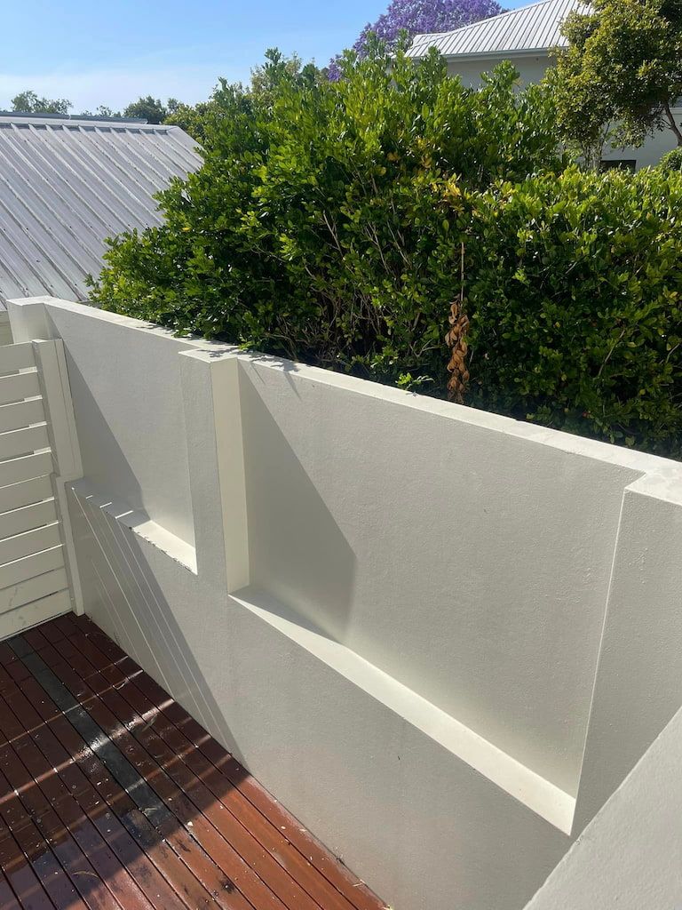 A pressure cleaned exterior surface with a deck