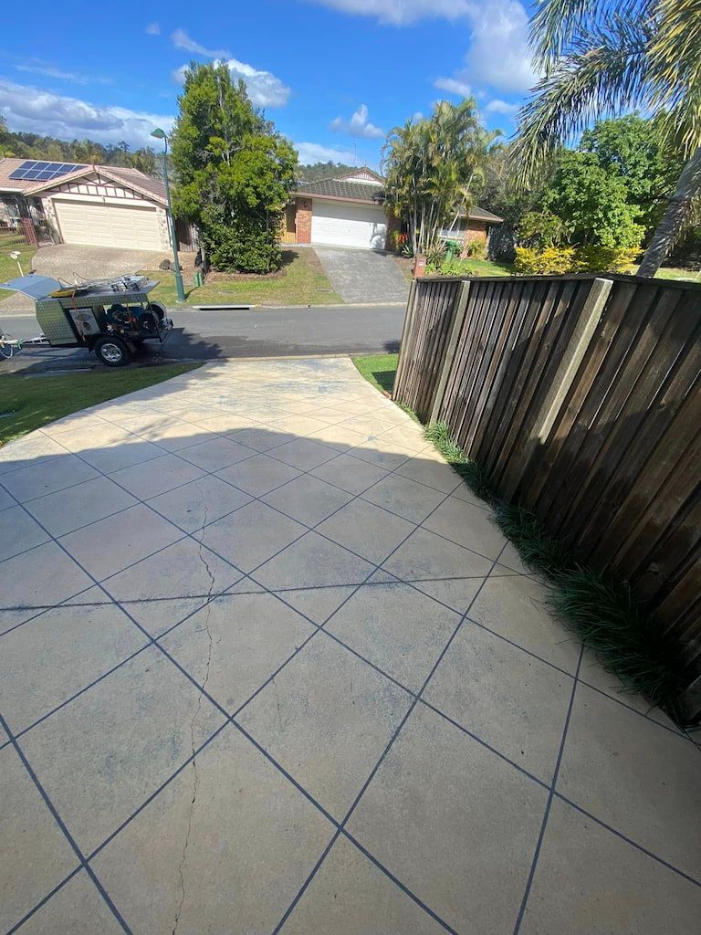 A pressure cleaned driveway leading towards the road