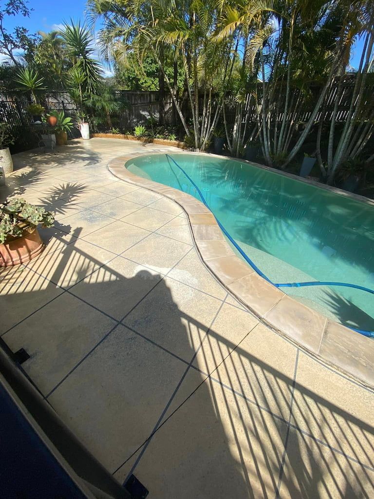 Pressure cleaned pool tiles next a pool on the gold coast