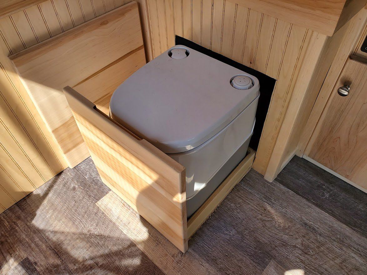 Grey Toilet Inside The Camper Van  - Milton, NH  - RV Service and R & L Van Builds
