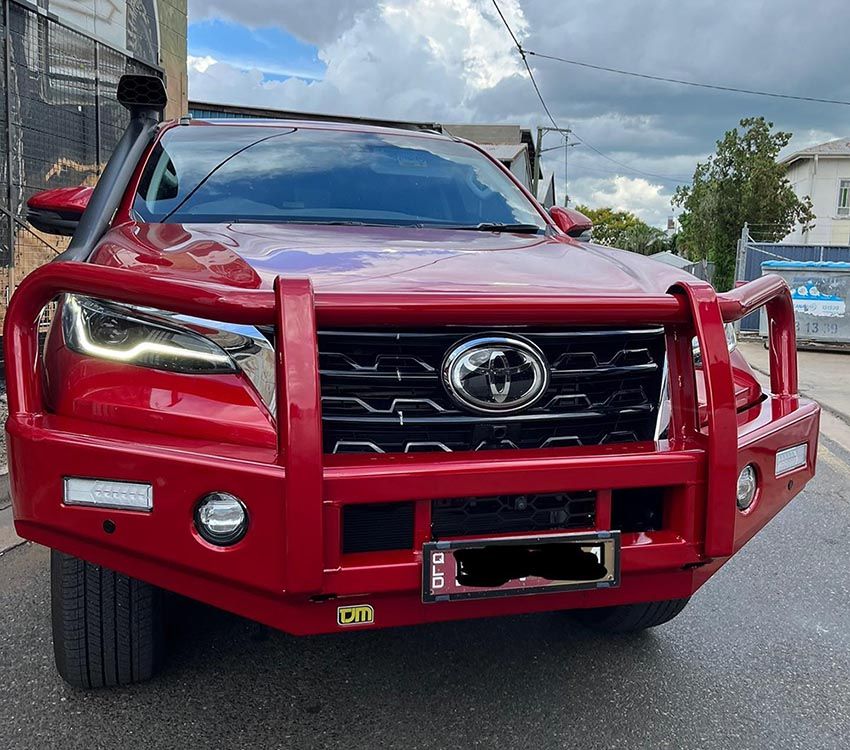 A Red Toyota Truck — Lacey's TJM 4X4 Megastore in Rockhampton City, QLD