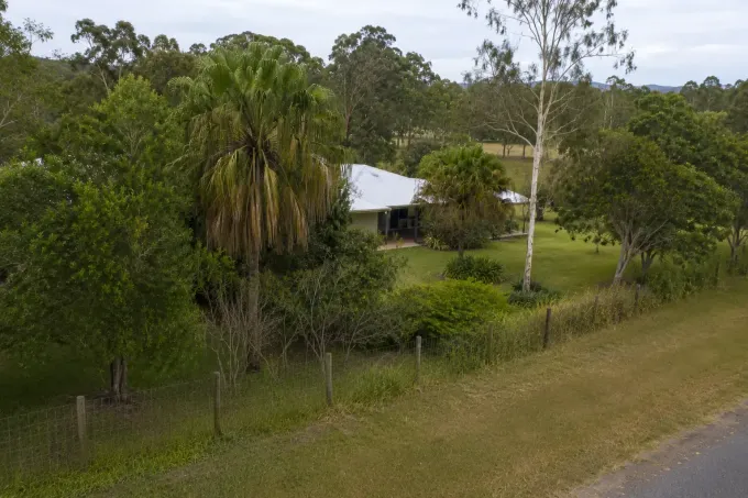 Aerial view of a small rural property requiring tree pruning and maintenance, near Marian. Mackay region.