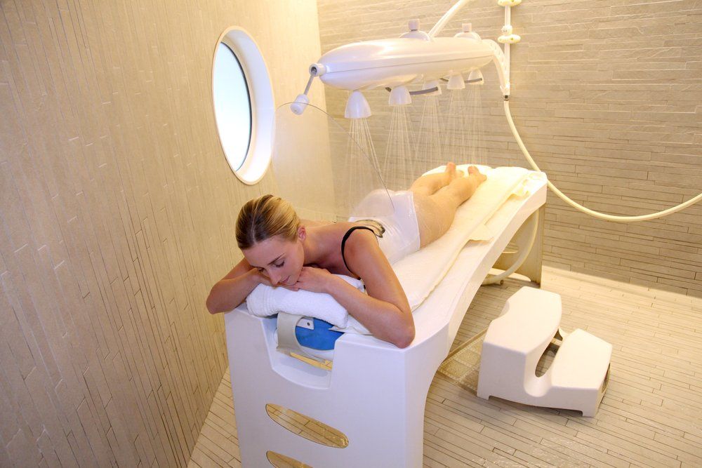 A man is getting a massage at a spa.