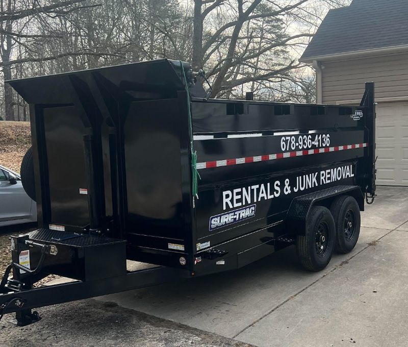 A dumpster trailer for rentals and junk removal