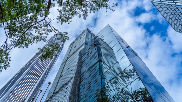 Modern office building against blue sky