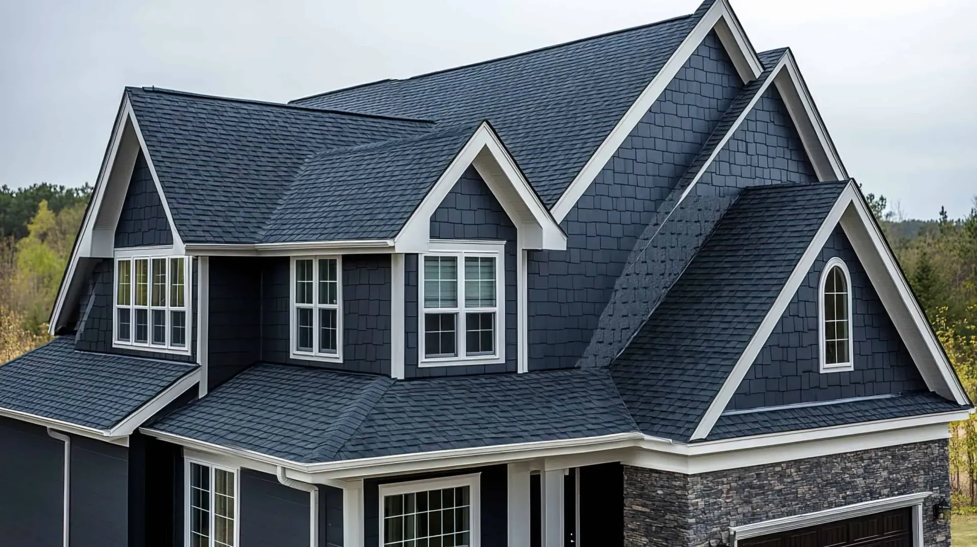 Dark blue roofed house with white trim.