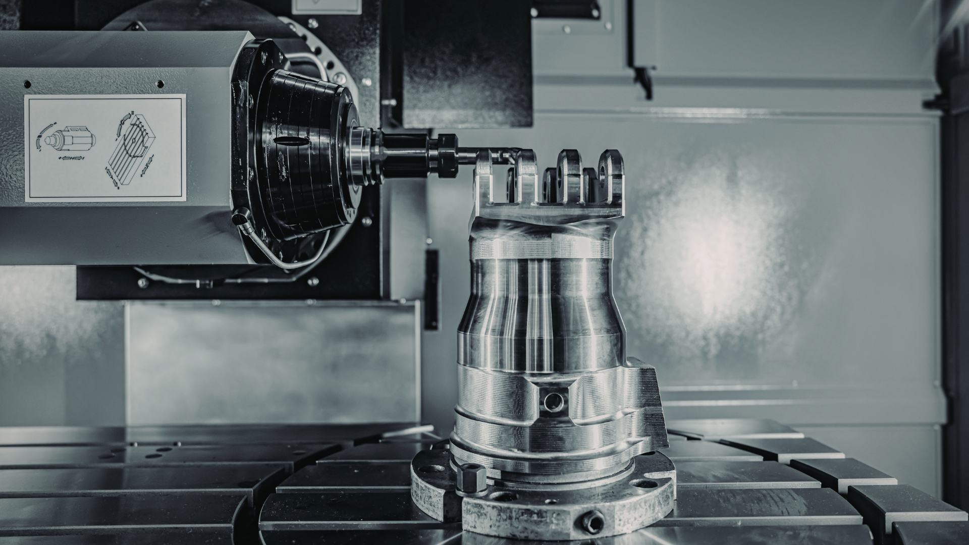 Industrial machine tool cutting a metal part in a precision machining workshop