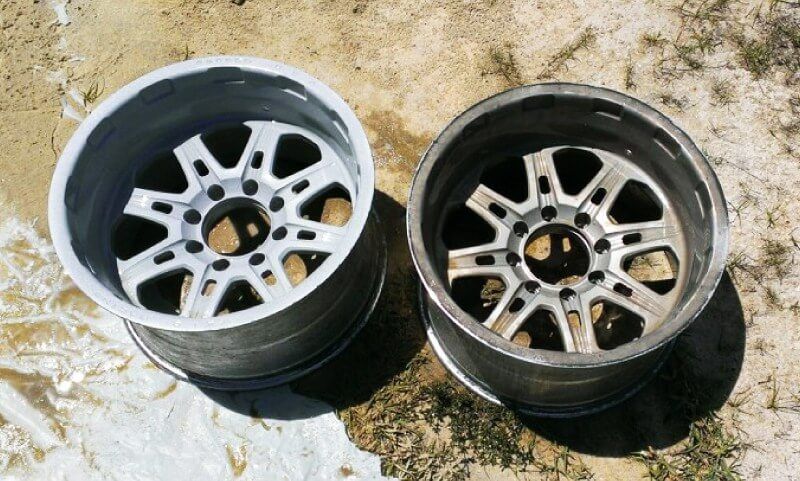 Before and after of media blasted wheels on the ground