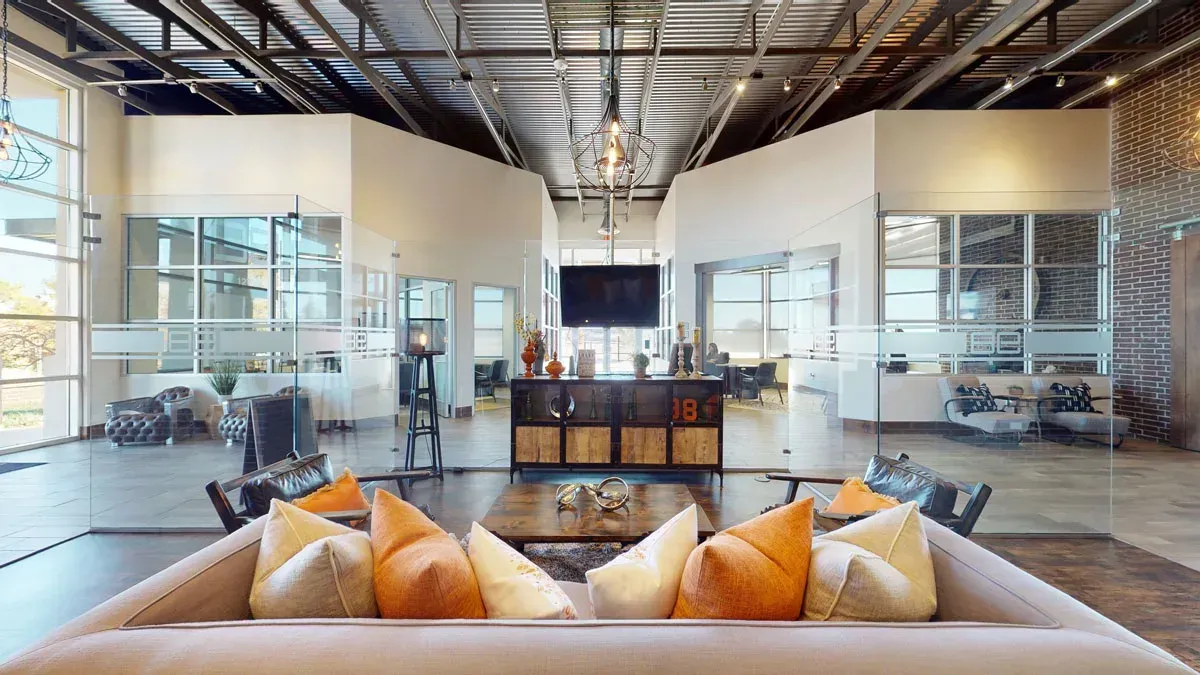 Clubhouse with a couch and pillows in it.